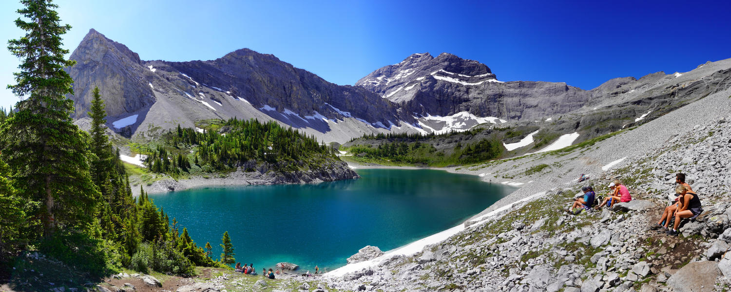 image of lake and hikers