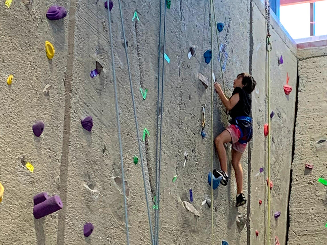 child climbing on indoor wall