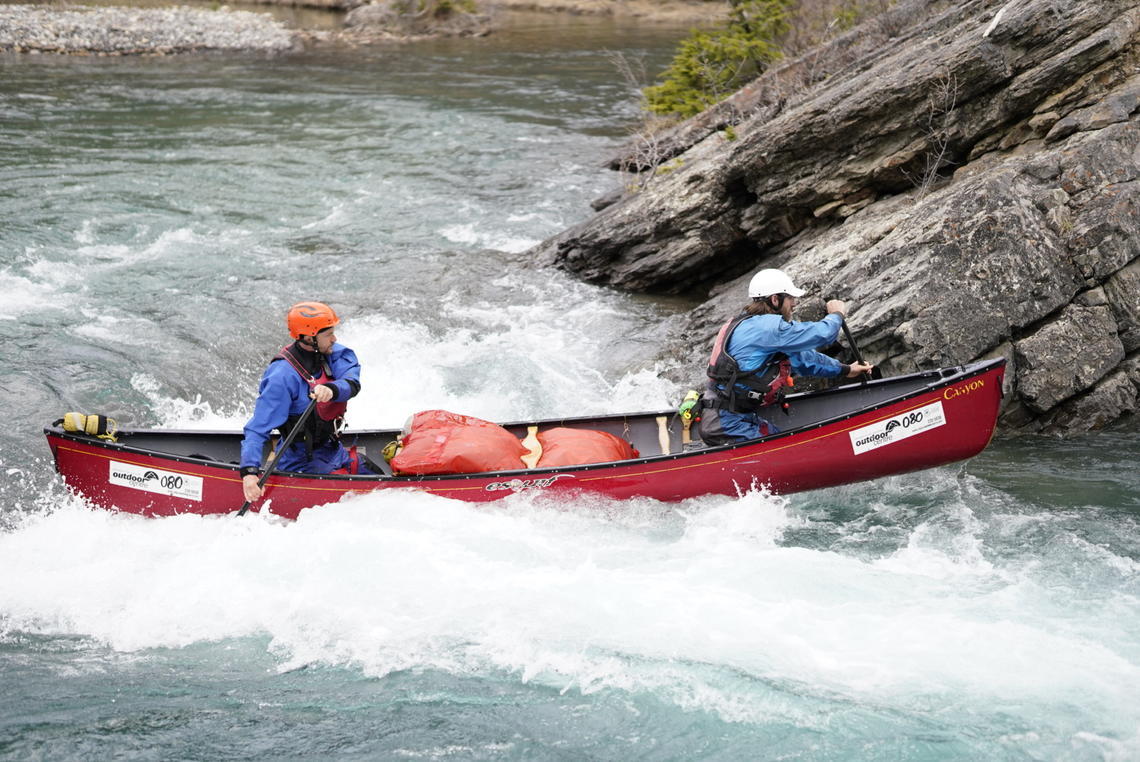 image of two paddlers in canoe on whitewater