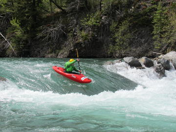 whitewater kayak on river wave