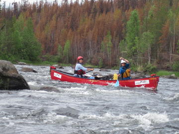 canoe on small rapids