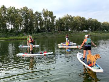 group on SUPs on pond