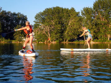 two paddlers on flat water