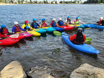 kayakers in lesson on lake