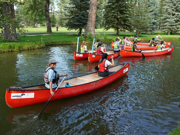 fleet of canoes in canal