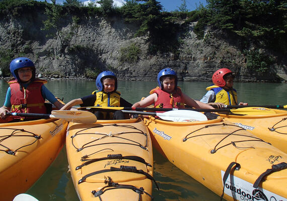 children in kayaks