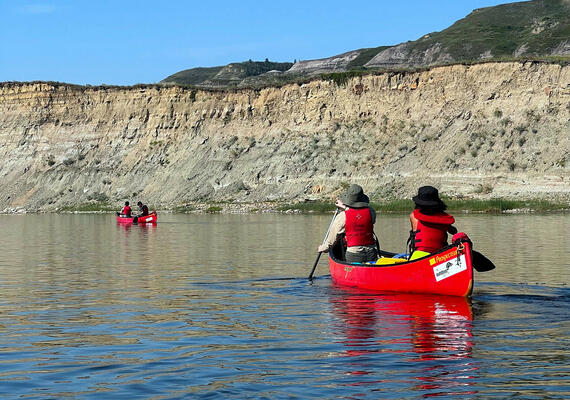two canoes on placid river