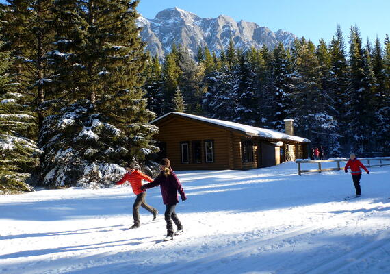 skiers in front of hut