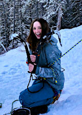 person on snow holding ice axes